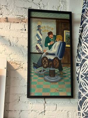 Vintage barber painting on the shop wall